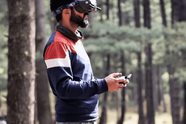 Cameraman frames forest landscape, deep focus shot.